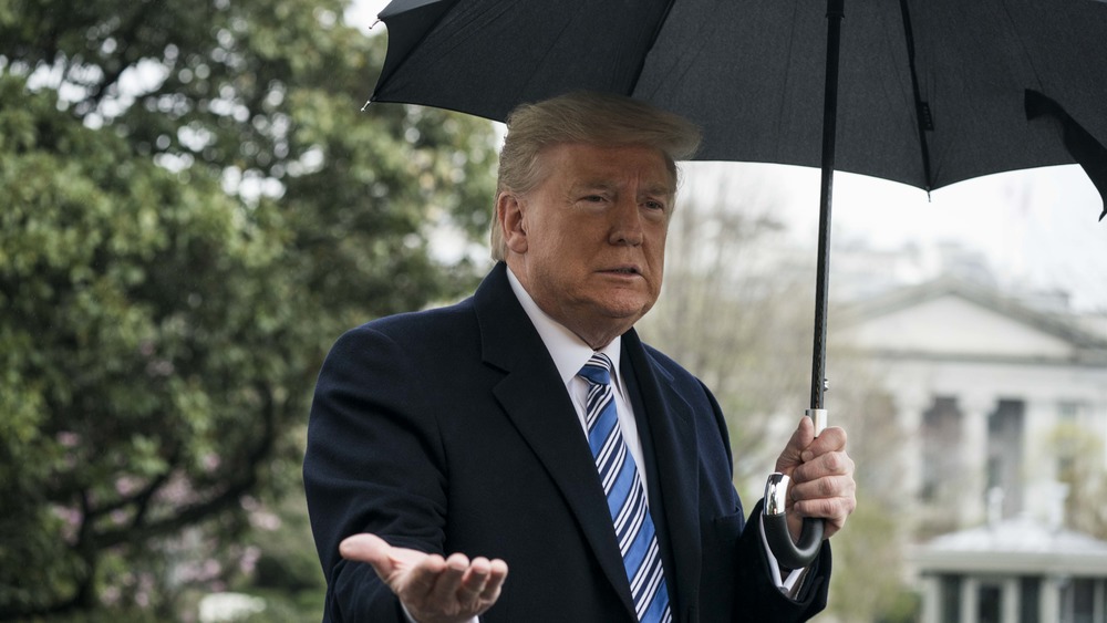 Trump with umbrella