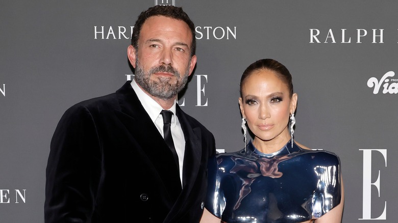 Ben Affleck and Jennifer Lopez posing on red carpet