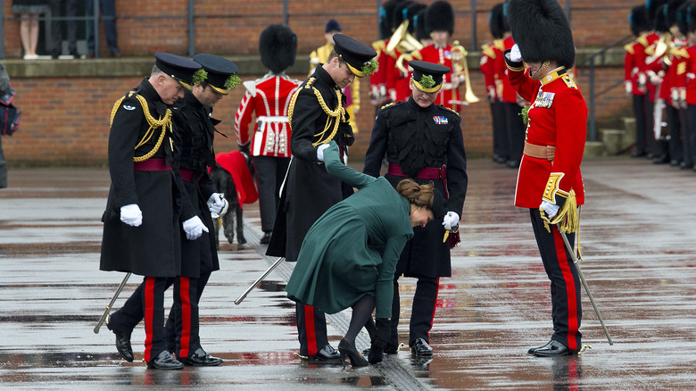 Kate Middleton freeing her shoe from a grate