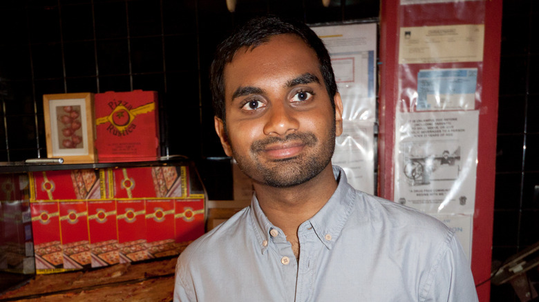 Aziz Ansari smiling