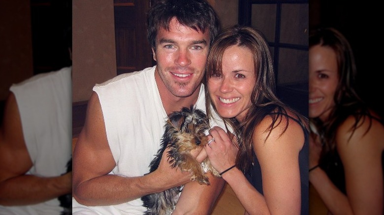 Trista and Ryan Sutter pose with dog