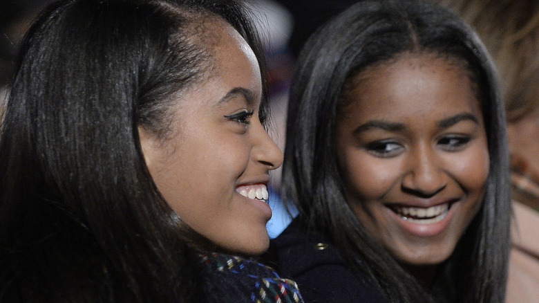 Sasha and Malia Obama smiling