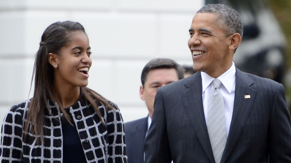 Malia Obama and Barack Obama