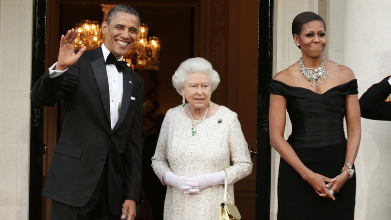 Barack Obama, Queen Elizabeth II, and Michelle Obama waving