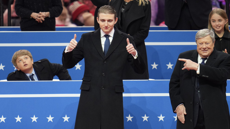 Barron Trump giving a thumbs up at Donald Trump's inauguration event