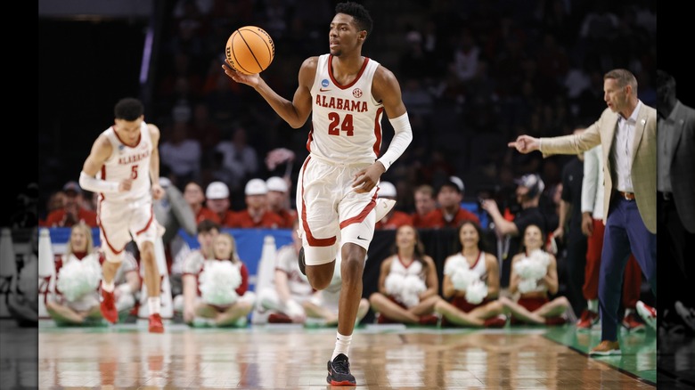 Brandon Miller running with basketball