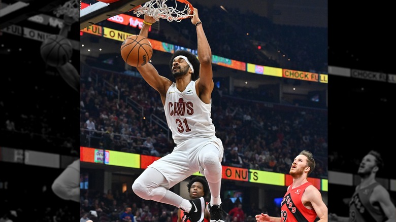 Jarrett Allen holding basketball hoop