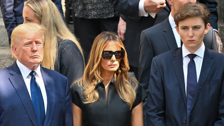 Donald Melania Barron Trump standing