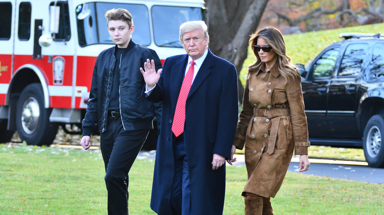 Barron Trump walking with his parents