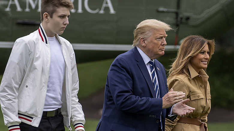 Barron Trump, Donald Trump, and Melania Trump outside