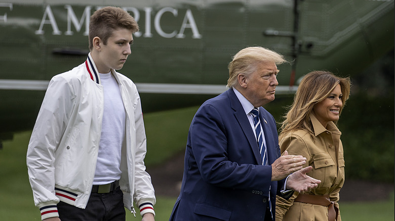 Barron Trump walking behind his parents