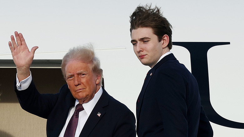 Donald Trump and Barron Trump boarding a plane