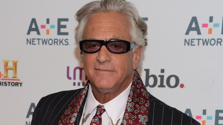 Barry Weiss looks on, red carpet