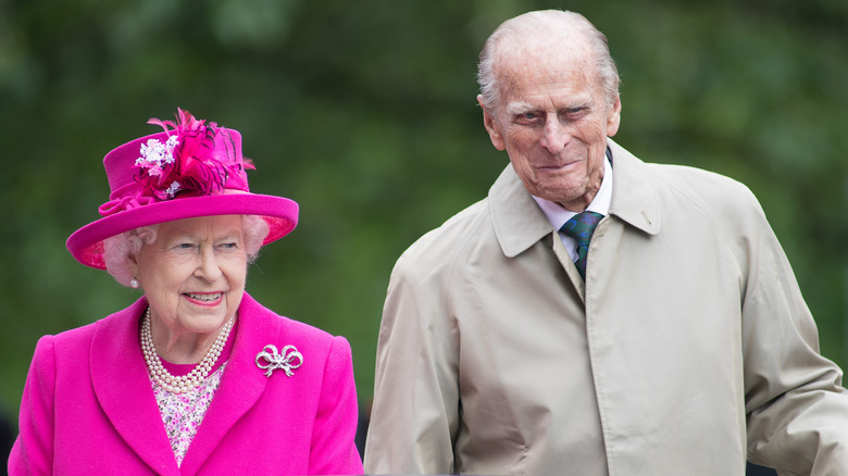 Queen Elizabeth II in pink suit with Prince Phillip