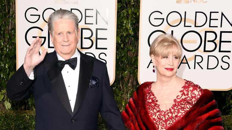 Brian and Melinda Wilson smiling at red carpet event