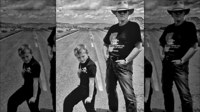 Young Beckett Rex and Malcolm McDowell posing