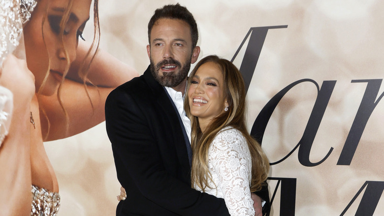 Ben Affleck and Jennifer Lopez smiling and laughing