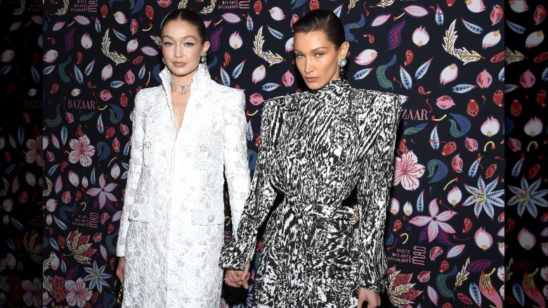 Bella and Gigi Hadid hold hands