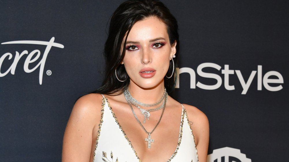 Bella Thorne with black hair and red eyeshadow