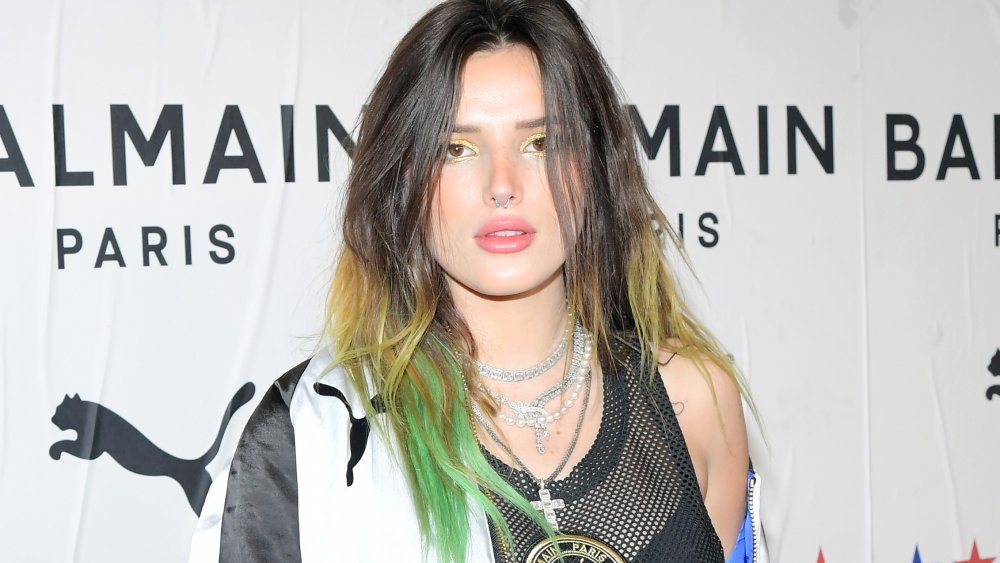 Bella Thorne with hair dyed green and blonde