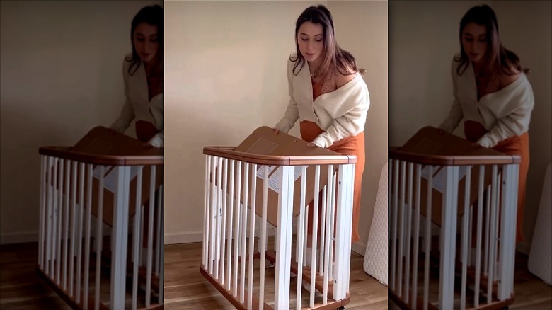 Anastasia Surmava assembling crib