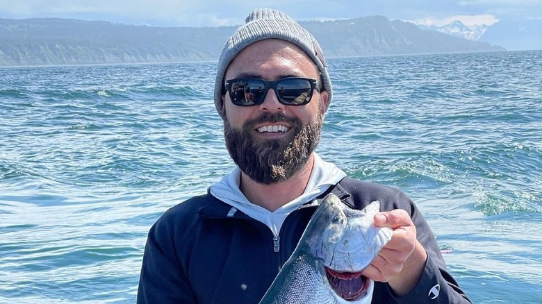 Aleks Taldykin holding a fish