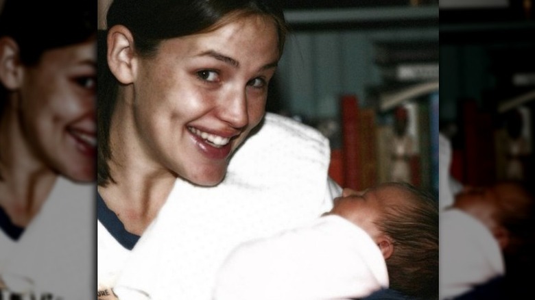 Jennifer Garner posing with one of her children