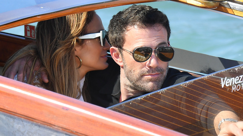 Jennifer Lopez and Ben Affleck cuddling up on a boat in Venice.