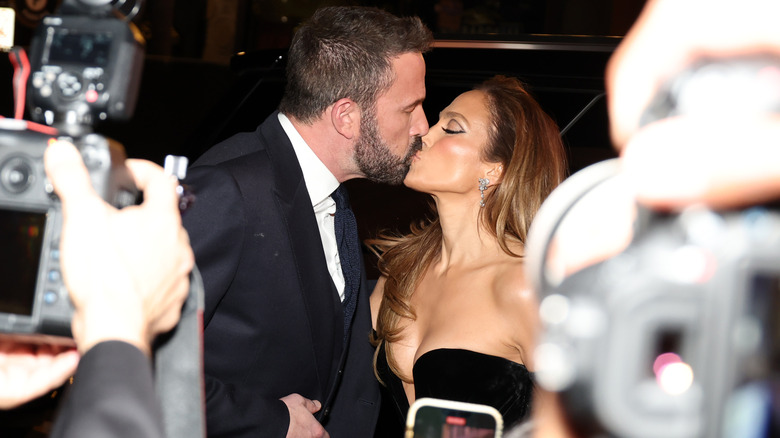 Ben Affleck and Jennifer Lopez kissing at the premiere for her short film.