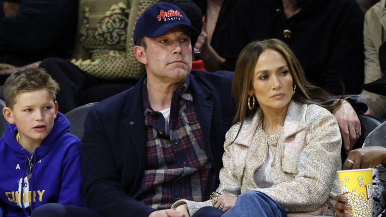 Jennifer Lopez and Ben Affleck watching a Lakers game alongside Ben's son Samuel.