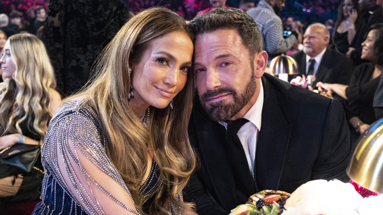 Ben Affleck and Jennifer Lopez posing together at an event