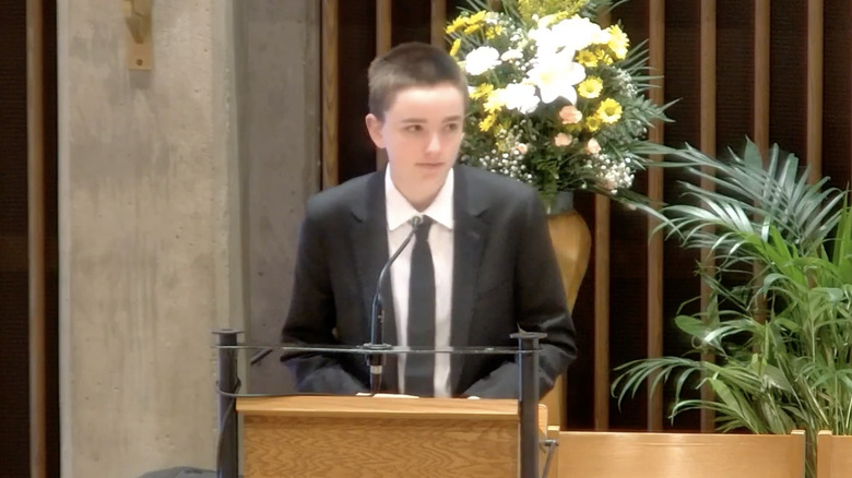 Fin speaking at funeral 
