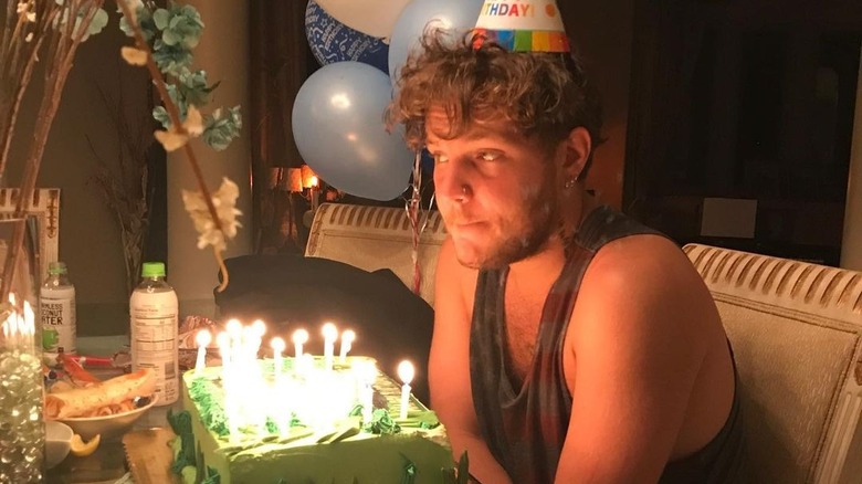 Benjamin Keough wears a birthday hat.