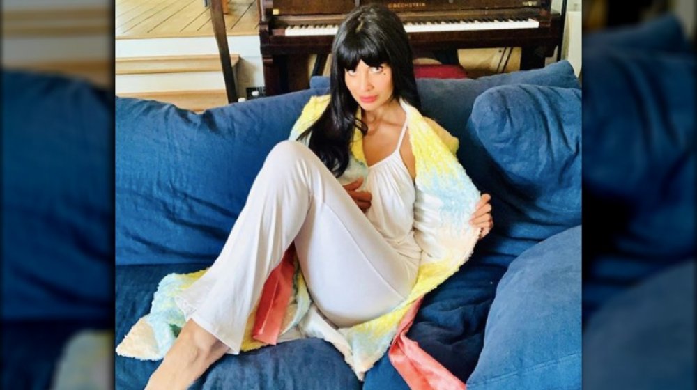 Jameela Jamil at home in a sequinned robe