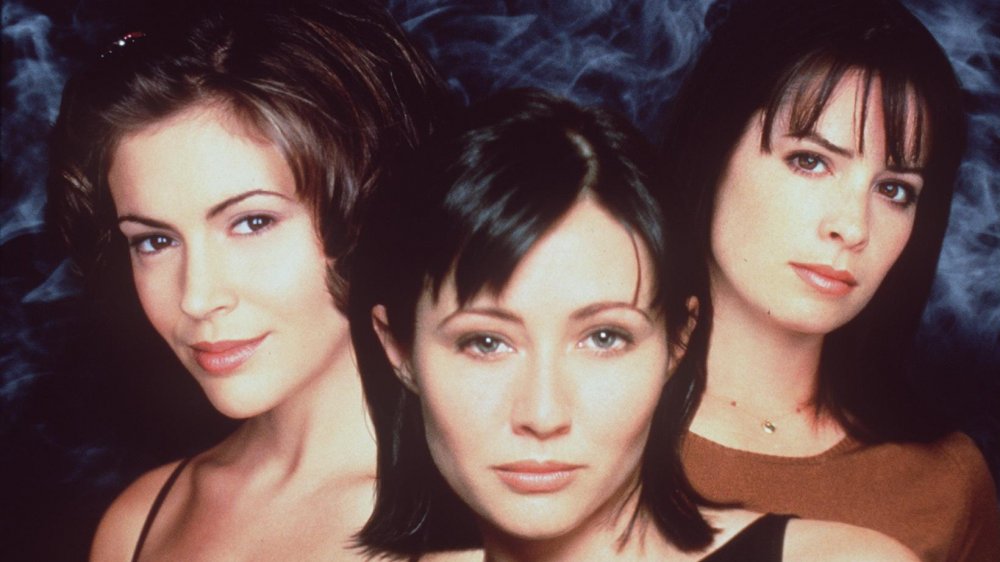 Alyssa Milano, Shannen Doherty, and Holly Marie Combs posing for a Charmed promo