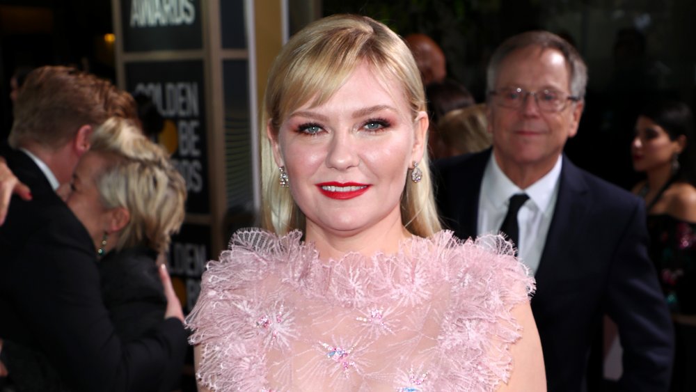 Kirsten Dunst in pink dress and red lipstick