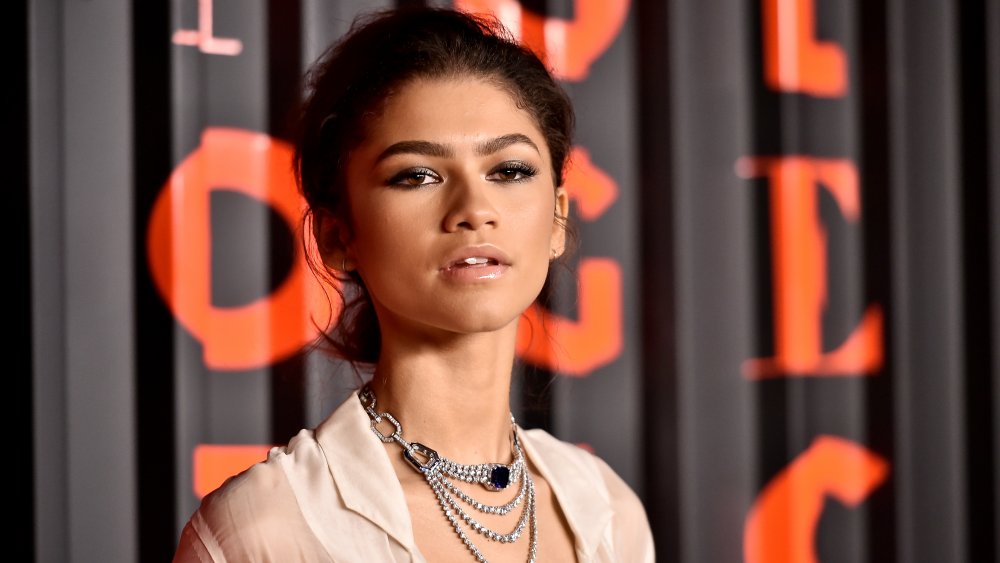 Zendaya in cream outfit and silver jewelry