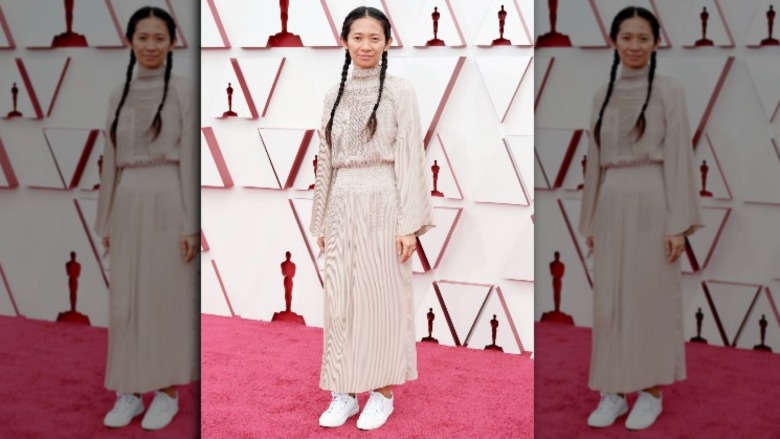 Chloe Zhao pigtails, sneakers red carpet