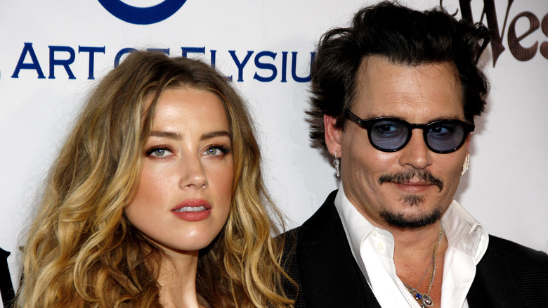 Amber Heard and Johnny Depp posing