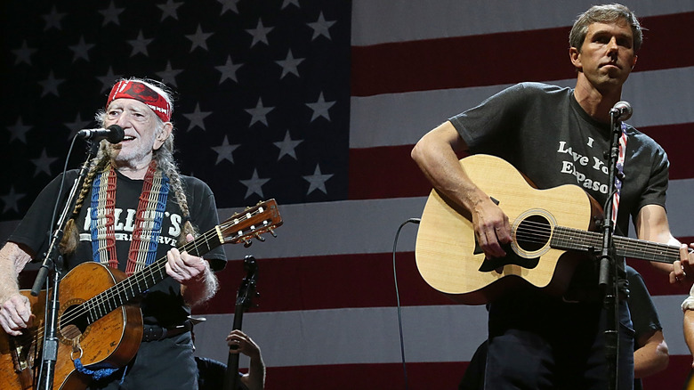 Beto O'Rourke playing guitar with Willie Nelson