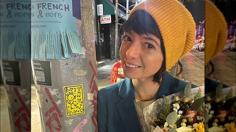 Kate Micucci wearing yellow beanie