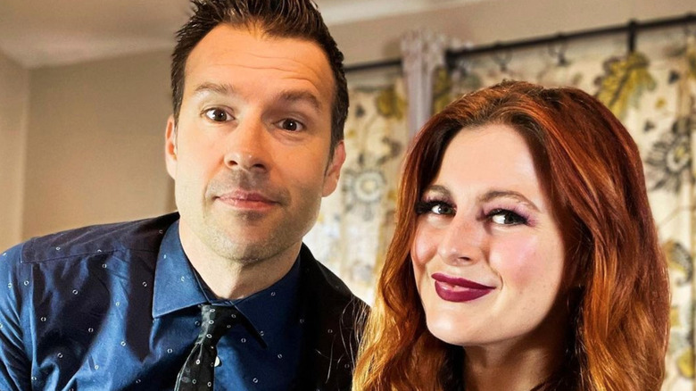 Rachel Reilly wears burgundy lipstick and Brendon Villegas wears a button down shirt and tie in an Instagram post