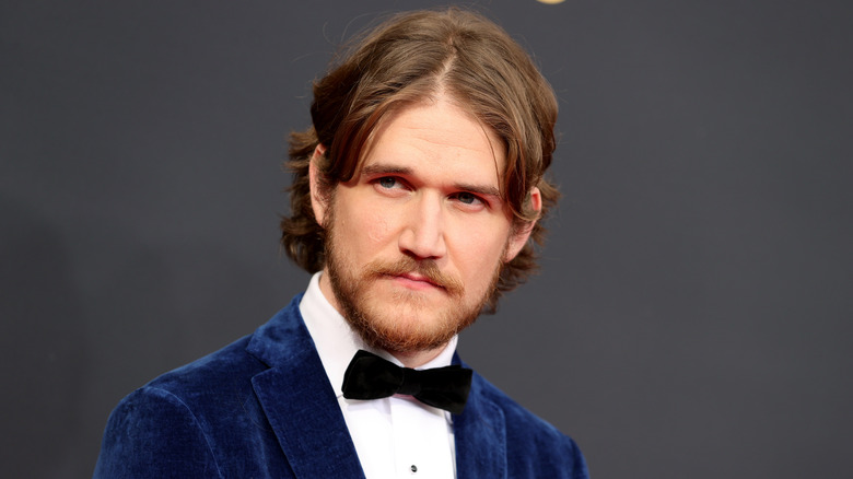 Bo Burnham posing on a red carpet