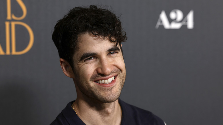 Darren Criss smiling at an event