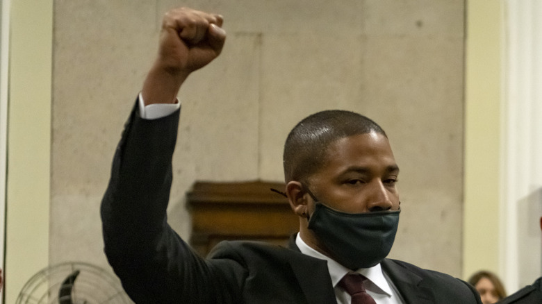 Jussie Smollett raises a fist in protest as court is in session