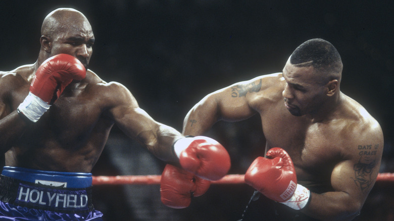Evander Holyfield and Mike Tyson in the boxing ring