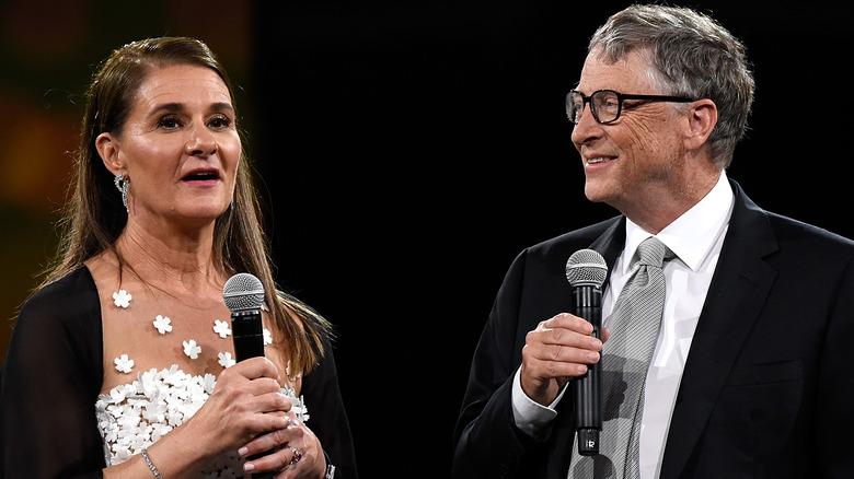 Melinda and Bill Gates talking into microphones