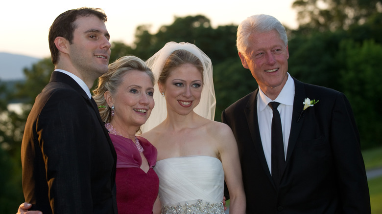 Marc Mezvinsky, Hillary Clinton, Chelsea Clinton, and Bill Clinton smiling