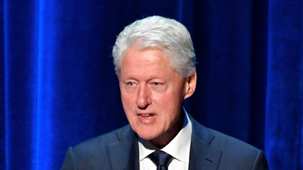 Bill Clinton speaking onstage in 2018