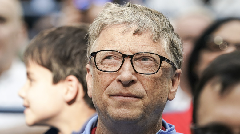 Bill Gates smiling and looking to the corner